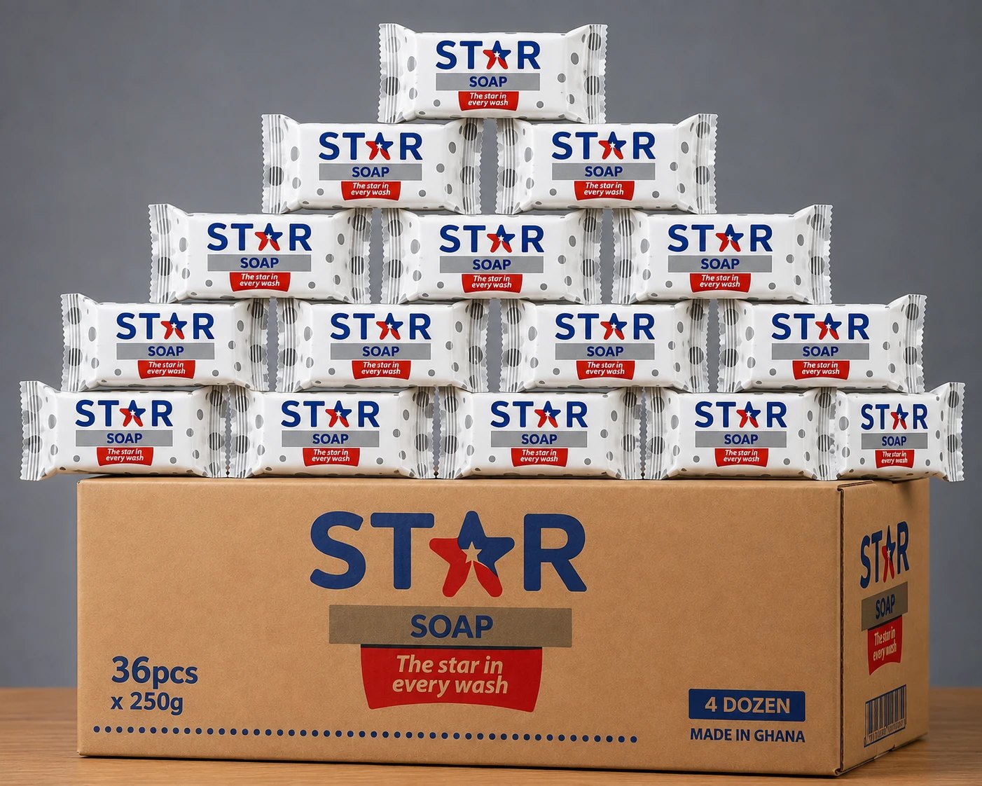 Wrapped STAR Soap bars stacked in a pyramid on a branded shipping carton — 36 pieces of 250 grams, made in Ghana